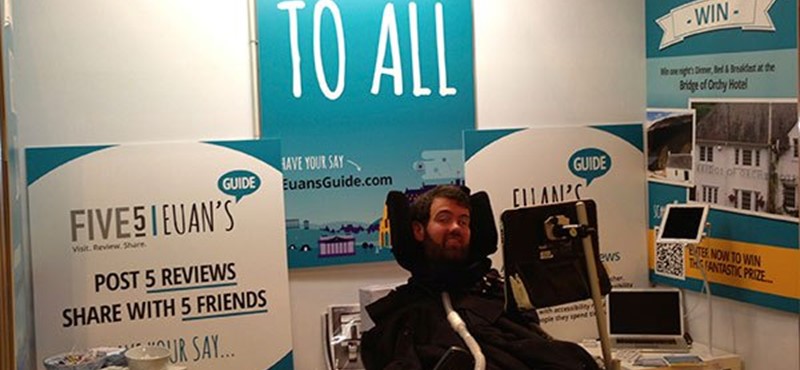 A photo of Euan at the Euan's Guide stall.