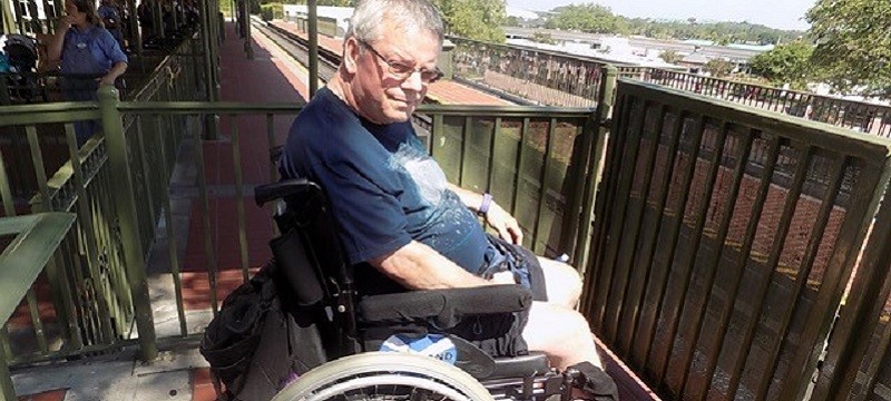 Photo of Neil waiting to board the train.