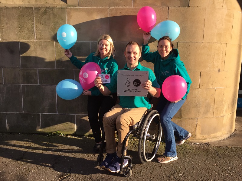 Photo of Ryan and members of the Euan's Guide team.