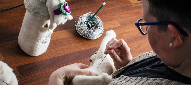 Photo of an artist felting.