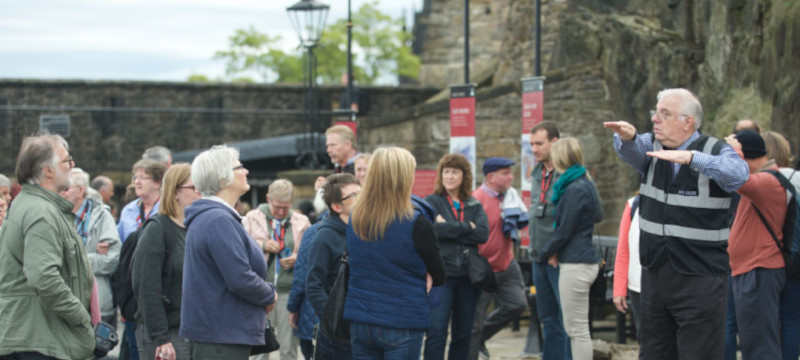 Photo of John May, BSL tour guide leading a tour at Edinburgh Castle.