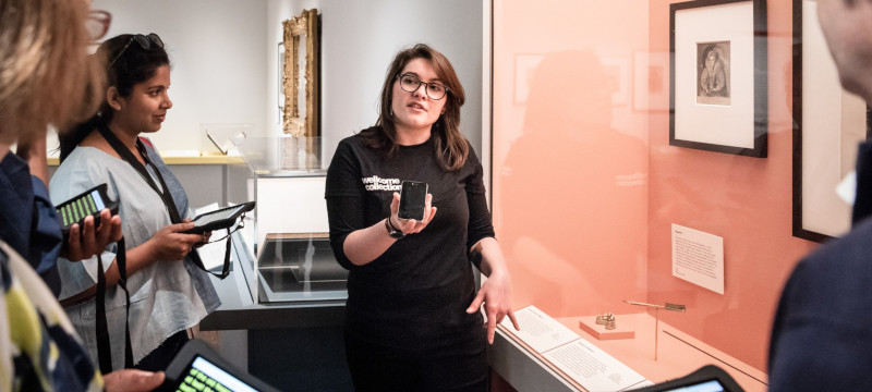 Photo of a guide at Wellcome using speech to text technology.