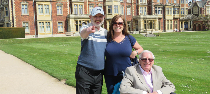 Image of three people outside a historic building on a MindforYou holiday