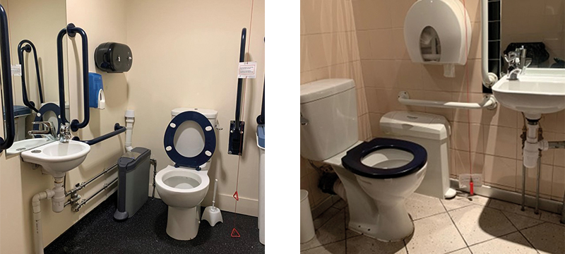 Image of two accessible toilets both with red cords hanging low to the floor.