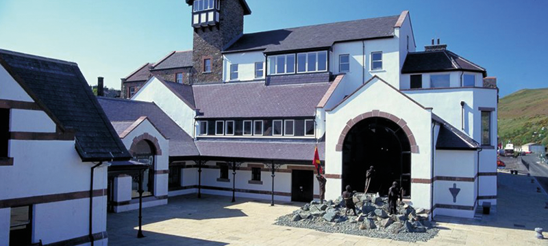 Image of entrance of a large stone building.