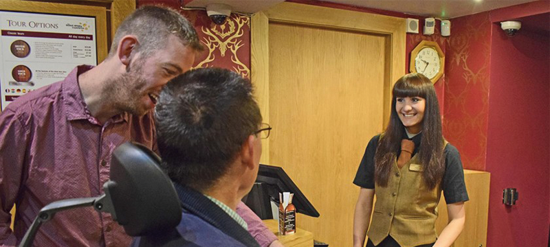 Image of people at a reception desk of an attraction.