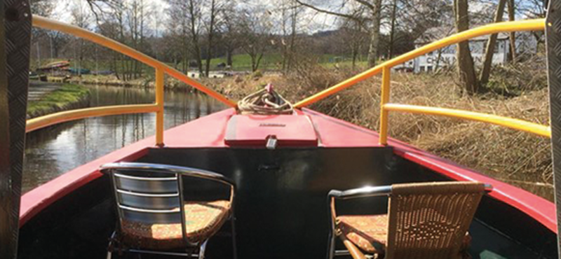 Image of canal taken from inside a canal boat.