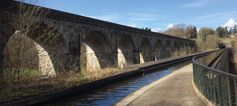 Image of a bridge next to a canal.