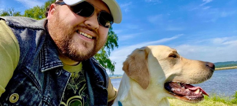 Image of Euan’s Guide Ambassador Jonathon Attenborough and his Guide Dog Sam.