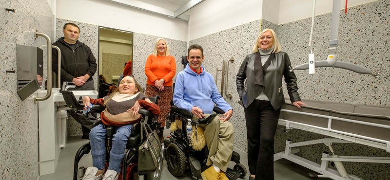 Five people in a Changing Places Toilet at Johnnie Walker Princes Street.