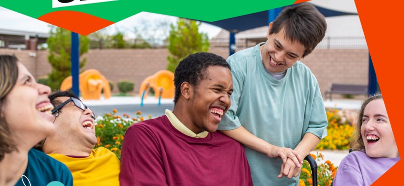 A graphic design using a green and orange backgroud just in sight, with the main part being a photograph of a group of people laughing together