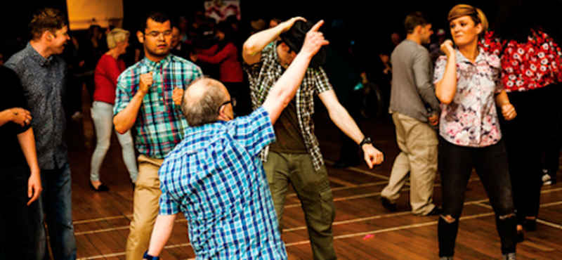 Photo of people dancing at a party.