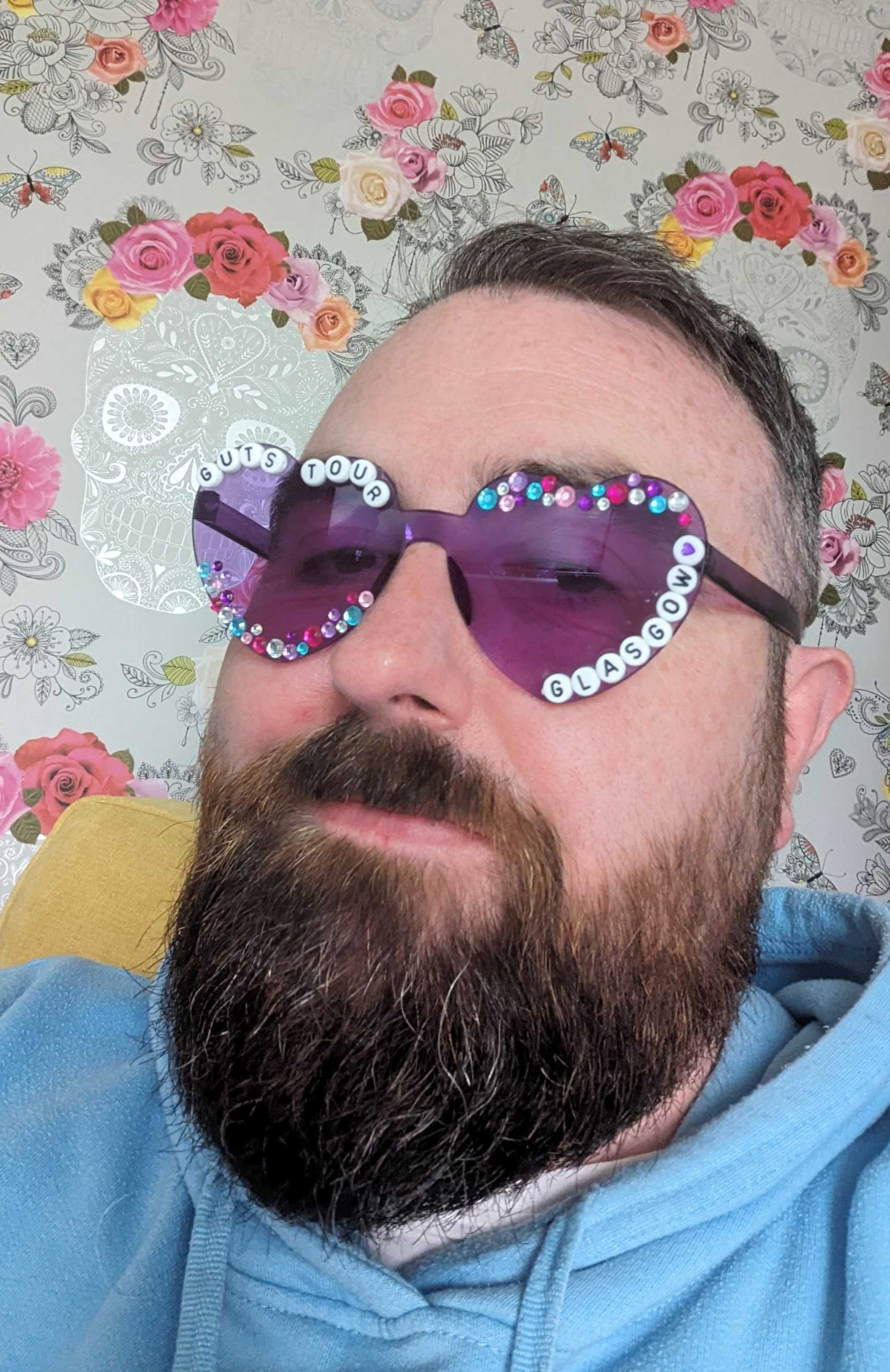 A selfie of Joe with heart sunglasses on