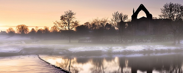 Photo of mist across Bolton Abbey.