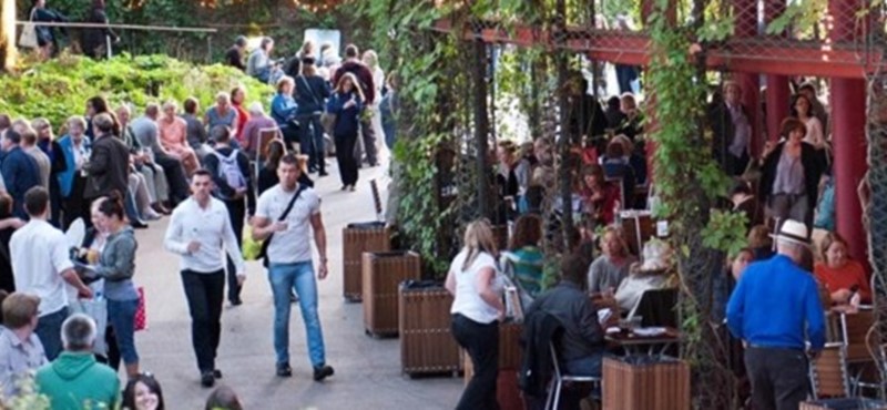 Photo of visitors to an open air theatre.