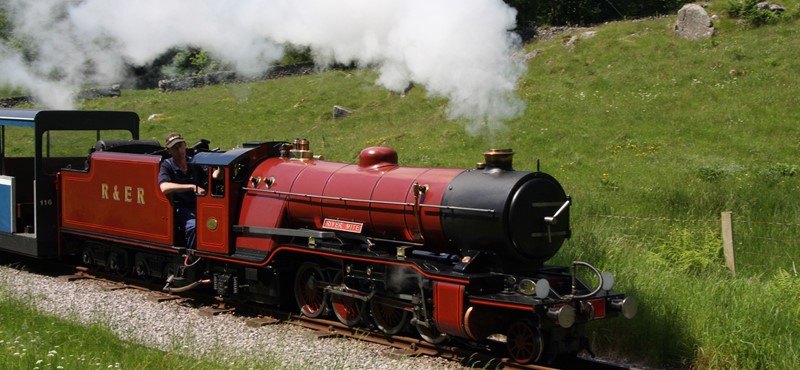 Picture of a red and black steam train at the Ravenglass ansd Eskdale Railway