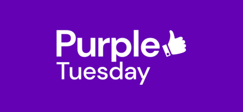 A graphic design of the words Purple Tuesday in white with a white illustrated thumbs up against a purple background