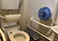 Image of toilet showing red cord too high