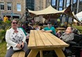 A picnic table with two wheelchair spaces so I can spend time with friends