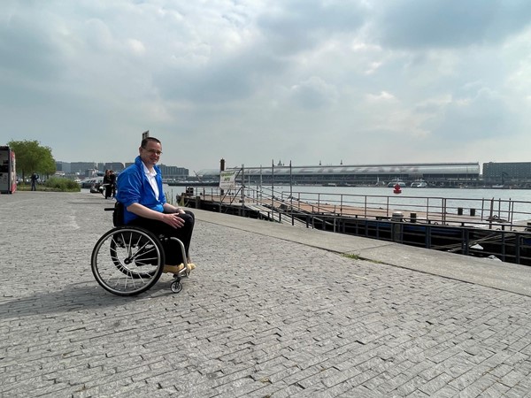 Over in Buiksloterweg on the river side, Paul sits and looks across the water toward the city