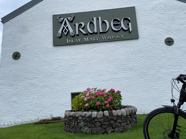 Image of a white building with a sign