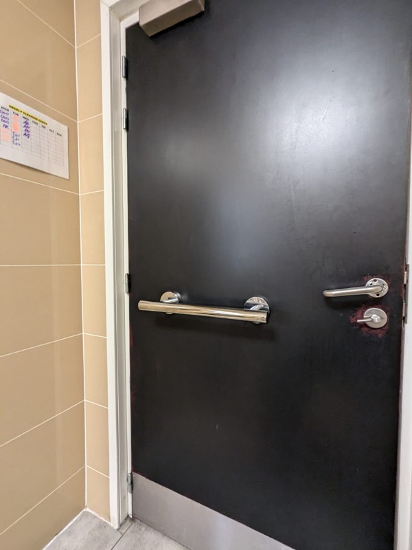 Image of the door in the ground floor accessible toilet