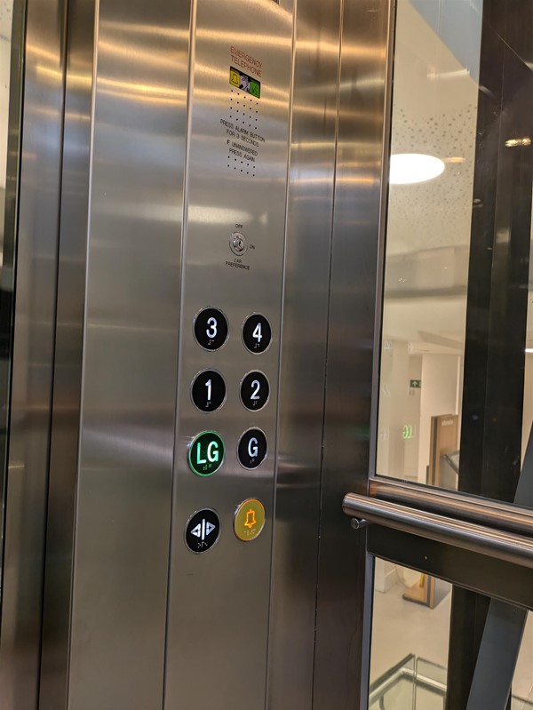 Image of lift buttons. The lift buttons have Braille Markings