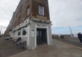 Image of a building with tables outside