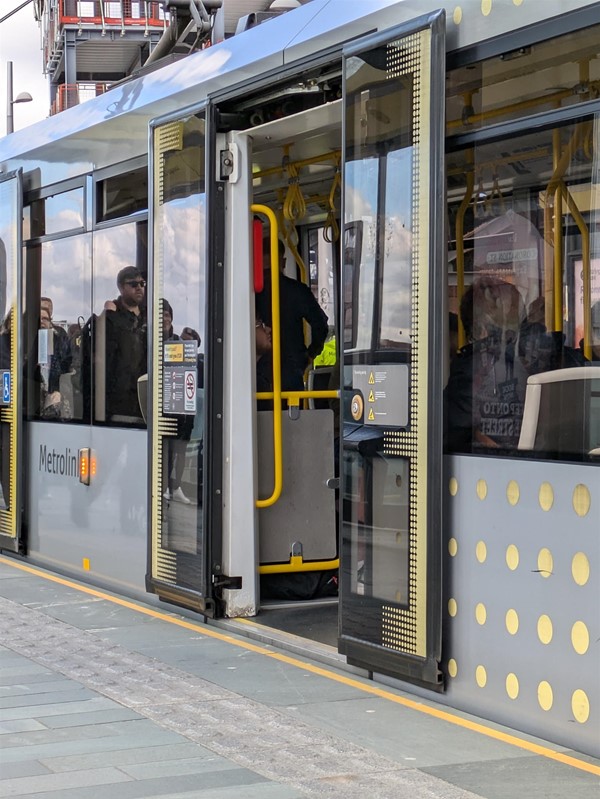 Image of the tram, flush against the platform