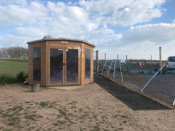 Image of the hut in the dog park.