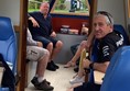 Picture of people sitting inside a narrow boat