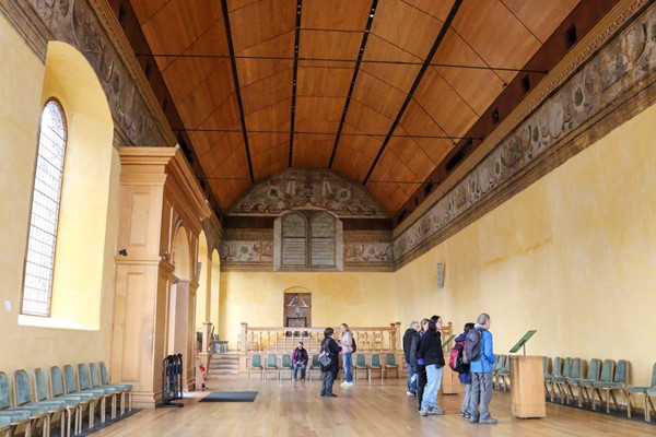 Inside the chapel, with lots of space and a hard level floor. There is plenty of seating around the edges.