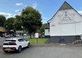 Image of a car parked in front of a building