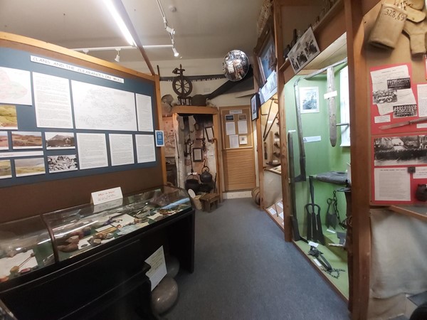 Image of a room with a display of weapons