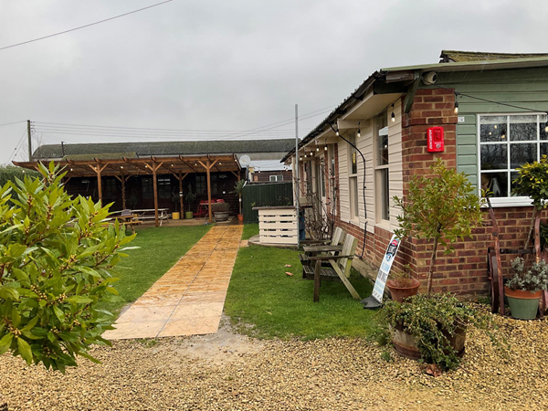 A small garden area led past a very small, full cafe