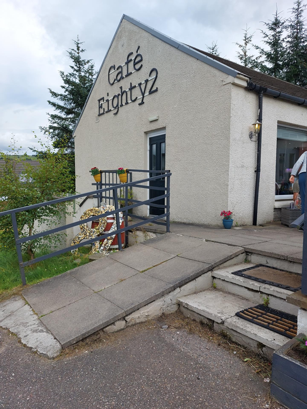 Image of a white building and a ramp