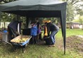 Image of people in the grounds outside the village hall.