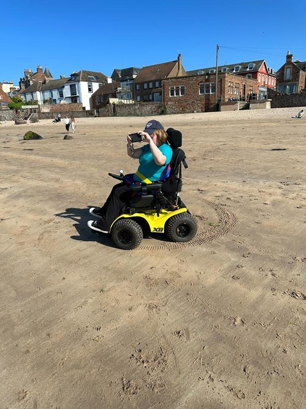 Taking pictures of the sea on the beach