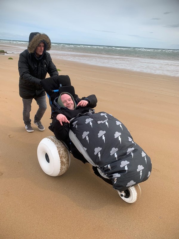 Picture of a person in a beach wheelchair