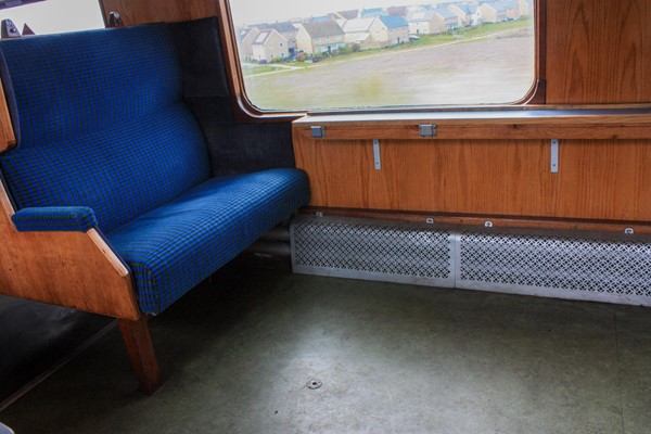 Train seat with loads of space in front for wheelchair