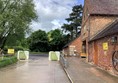 Picture of a road between red brick buildings