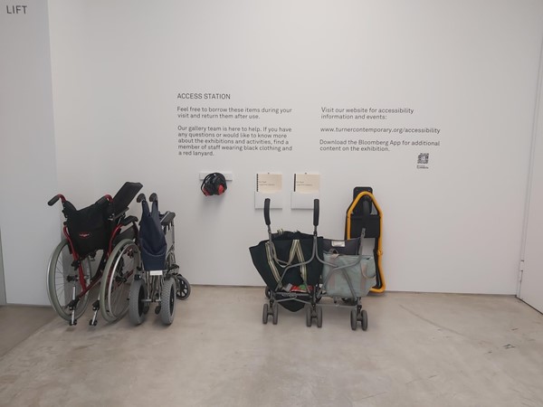 Image of a wheelchairs and luggage on a wall