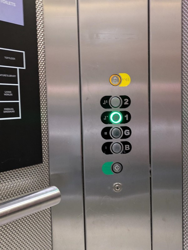 Image of buttons in lift. The lift buttons do not have Braille Markings