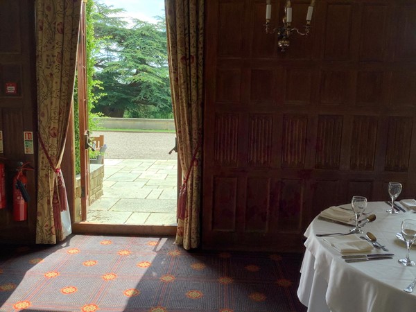 Picture of an open  door in the dining room, leading to the garden