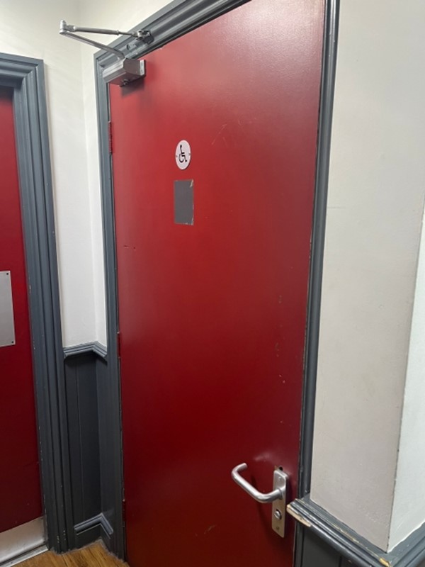 Image of an accessible toilet door