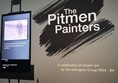 Shows the outside of the Pitman Painters exhibition with a subtitled video explaing the story of the Pitman Painters