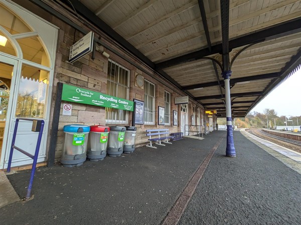 Image of platform, bins and ramped entrance to ticket office