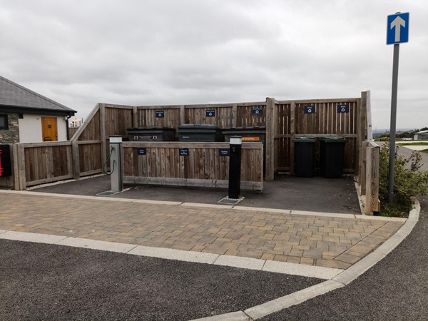 The bins area is all level access and the bins are just about reachable from a wheelchair - no worse than domestic ones.