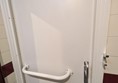 Image of grab rail on toilet door