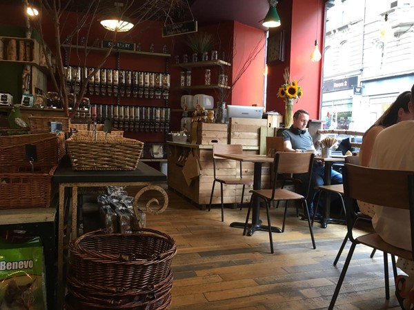 Image of some of the tables and a small shop.